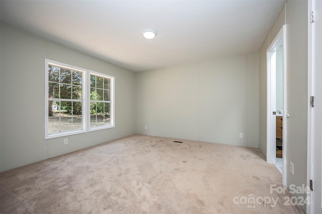 empty room featuring carpet flooring