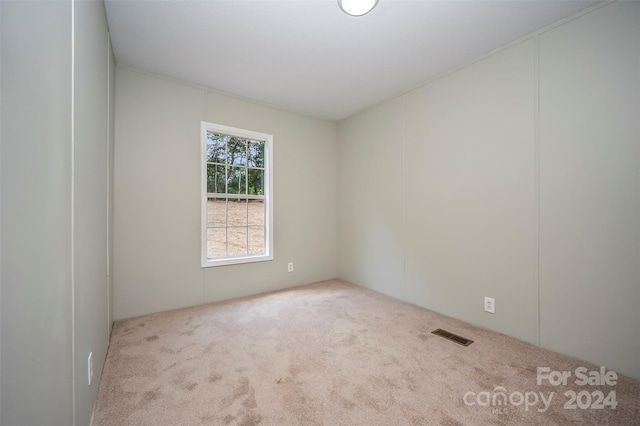 empty room with light colored carpet