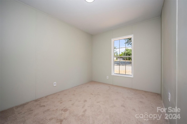 empty room with light colored carpet