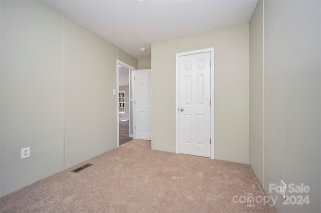 unfurnished bedroom featuring carpet