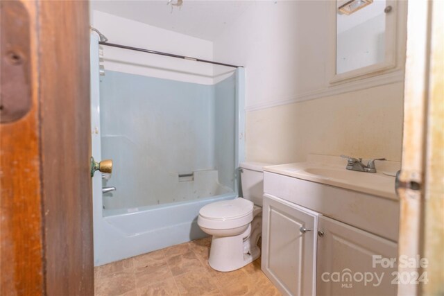 full bathroom with tile patterned floors, vanity,  shower combination, and toilet