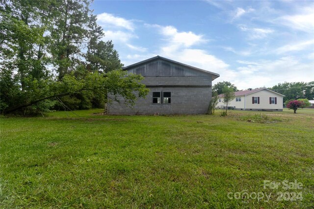 view of property exterior featuring a yard