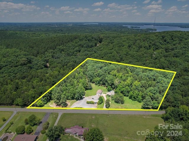 drone / aerial view featuring a forest view