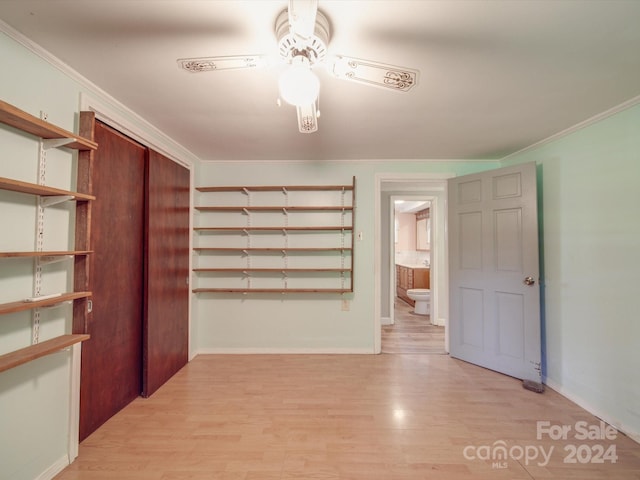 interior space with light hardwood / wood-style flooring and crown molding