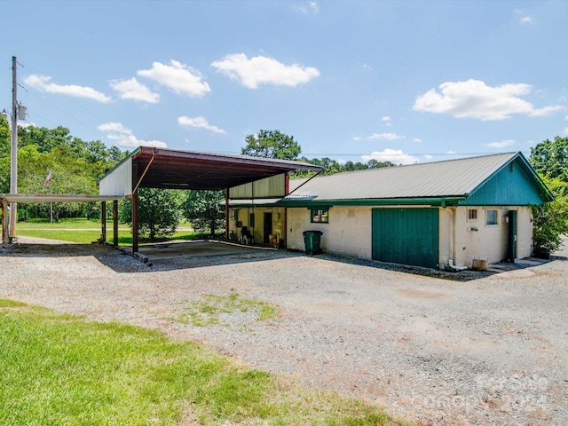 view of vehicle parking with a carport