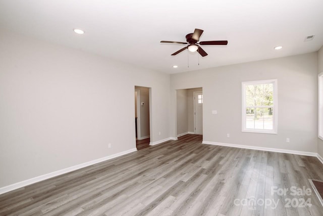 empty room featuring light hardwood / wood-style flooring and ceiling fan