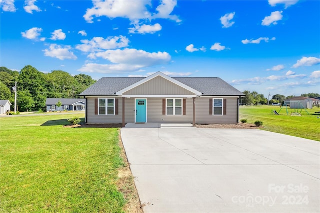 ranch-style home with a front lawn