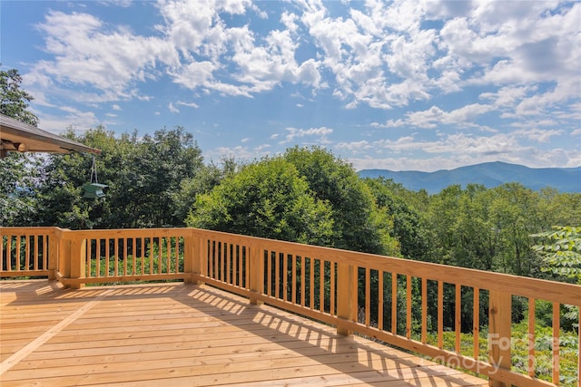 wooden terrace featuring a mountain view