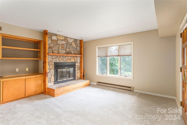 unfurnished living room with a baseboard heating unit, light colored carpet, a fireplace, and baseboards