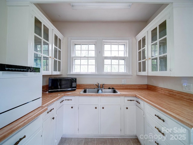 kitchen with white cabinetry and sink