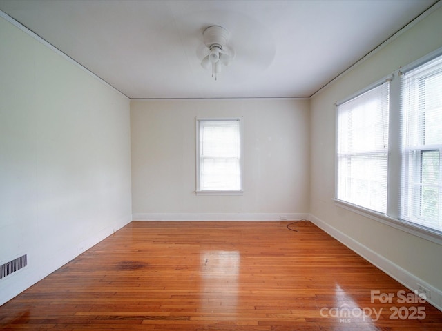 unfurnished room featuring light hardwood / wood-style flooring and ceiling fan