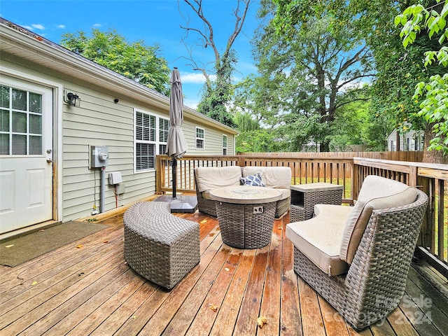 wooden deck with an outdoor living space