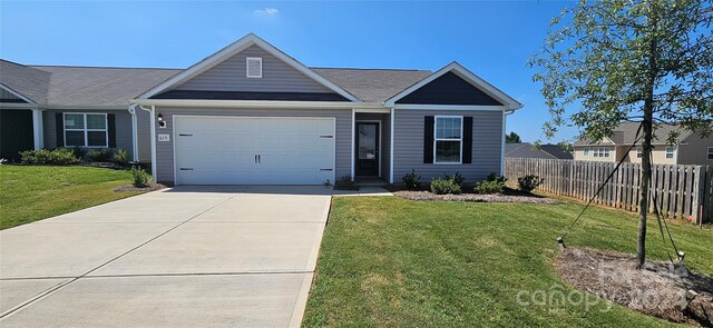 ranch-style home featuring a front lawn and a garage