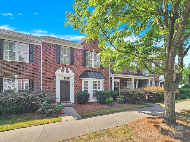 view of front of home with brick siding