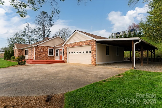 single story home with a carport, a garage, and a front lawn