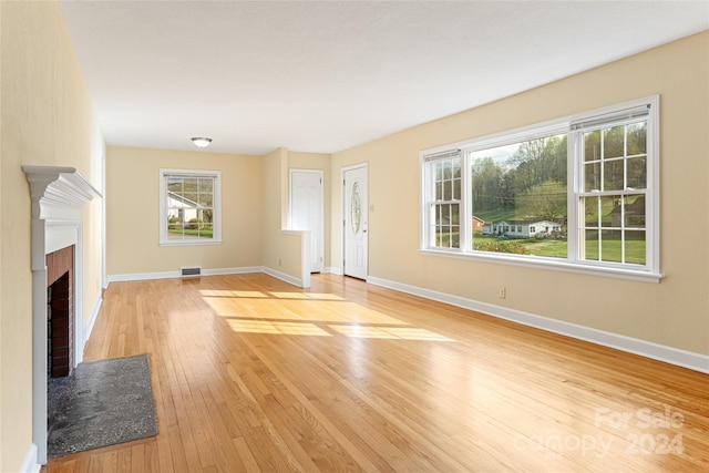 unfurnished living room featuring light wood-type flooring