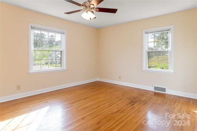 spare room featuring ceiling fan and light hardwood / wood-style floors