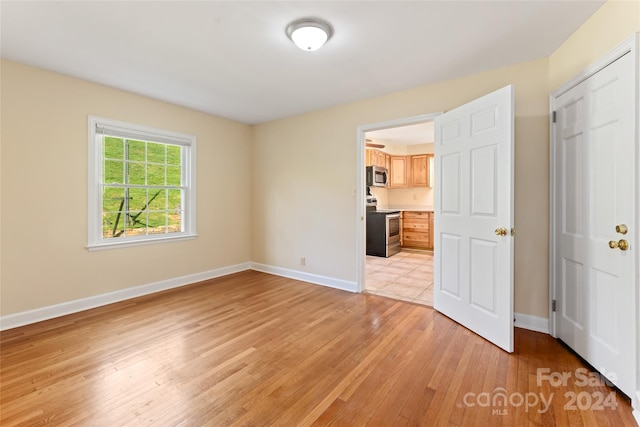 empty room with light wood-type flooring