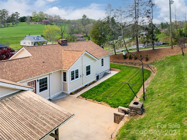 exterior space with a yard and a patio area