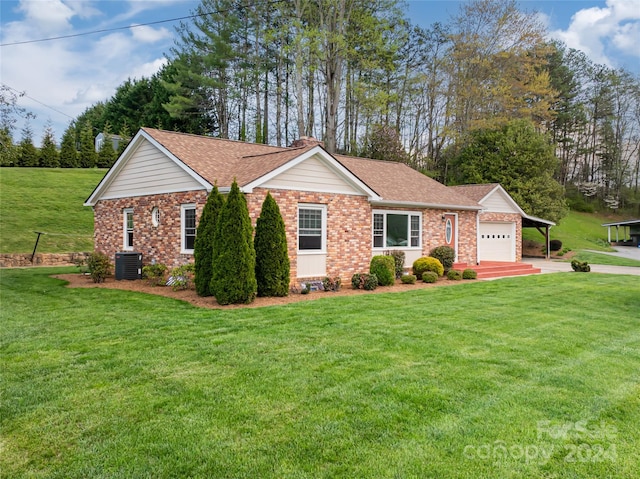 ranch-style house featuring central AC unit, a garage, and a front yard