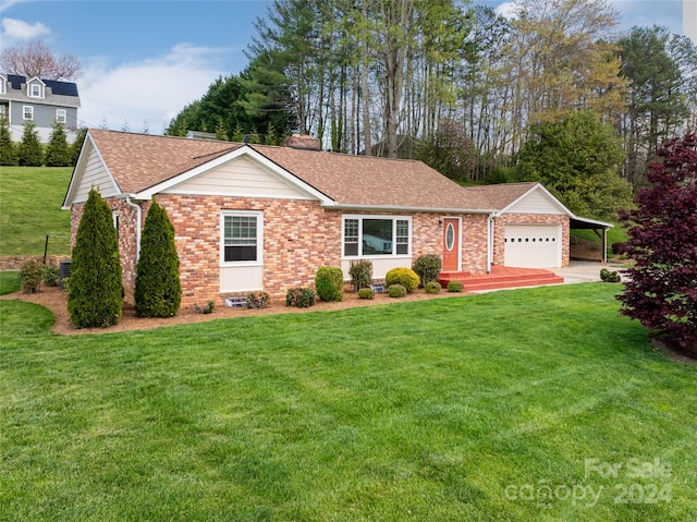 ranch-style home featuring a garage and a front lawn