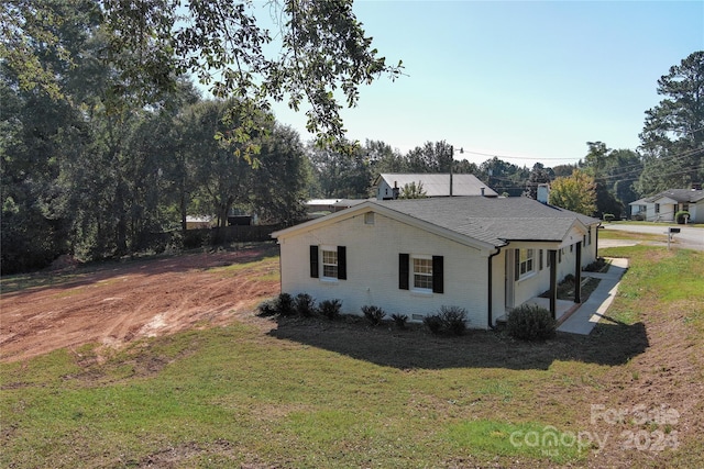 view of property exterior featuring a yard