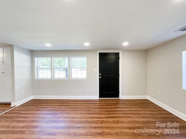 foyer with wood-type flooring