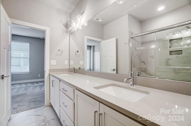 bathroom featuring vanity and walk in shower