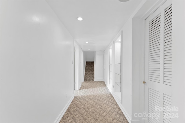 corridor with light carpet