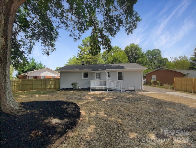 back of property featuring a deck