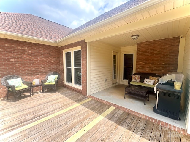 deck featuring an outdoor hangout area and grilling area