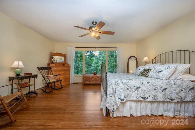 bedroom with dark wood-type flooring