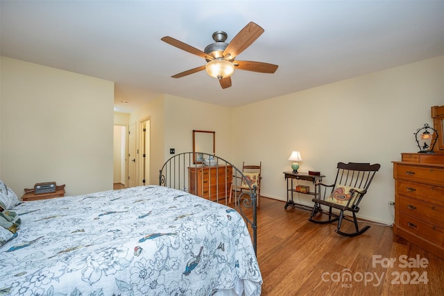 bedroom featuring wood-type flooring and ceiling fan