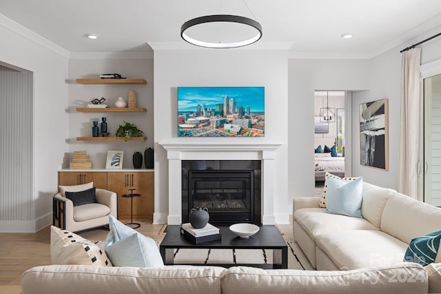 living room with light hardwood / wood-style flooring and ornamental molding