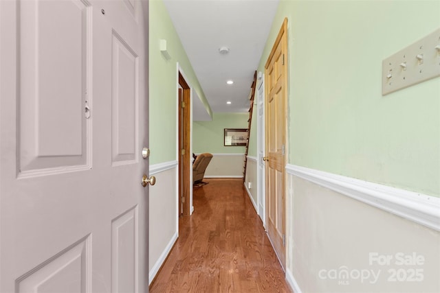 hallway with light hardwood / wood-style floors