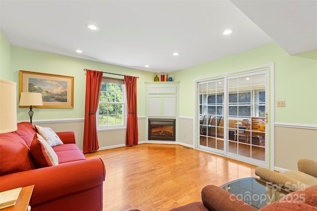 living room with light hardwood / wood-style flooring