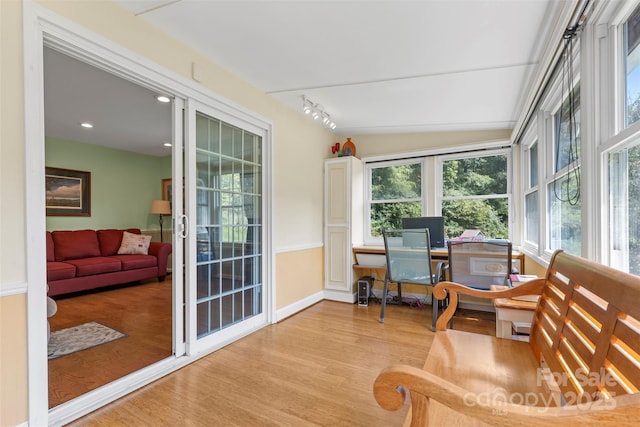 sunroom / solarium with lofted ceiling