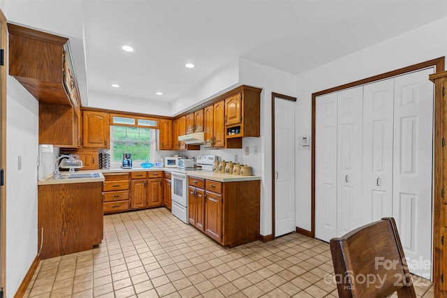 kitchen with electric range and sink