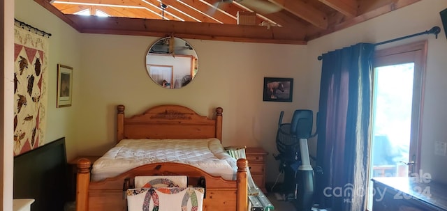 bedroom with multiple windows and vaulted ceiling