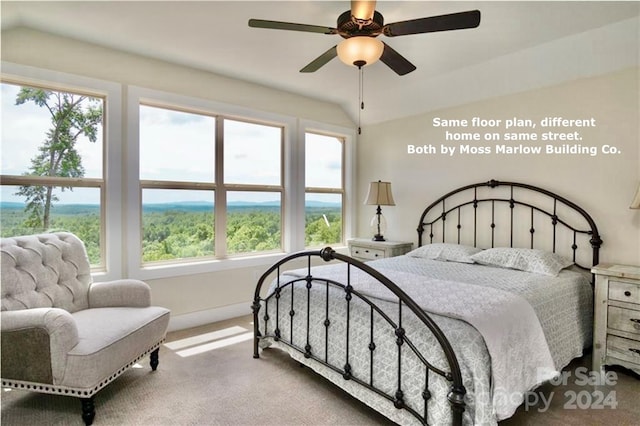 bedroom featuring ceiling fan and carpet