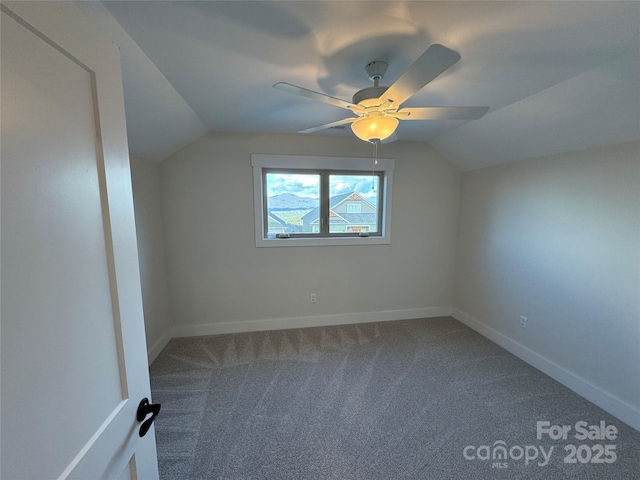 additional living space featuring lofted ceiling, carpet, baseboards, and ceiling fan