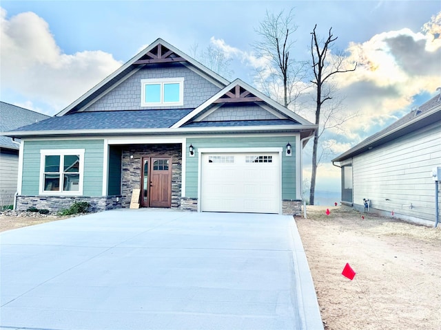 1387 River Club Rdg, Lenoir, NC 28645 - craftsman-style house with concrete driveway, an attached garage, stone siding, and a shingled roof