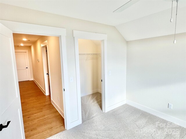 1387 River Club Rdg, Lenoir, NC 28645 - unfurnished bedroom featuring a closet, baseboards, a spacious closet, and vaulted ceiling