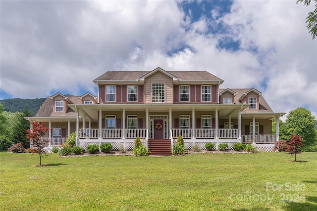 colonial inspired home with a porch and a front lawn