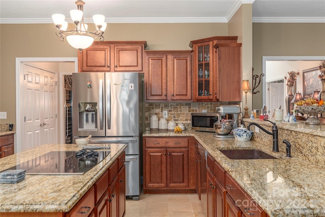 kitchen with decorative light fixtures, a notable chandelier, appliances with stainless steel finishes, ornamental molding, and sink