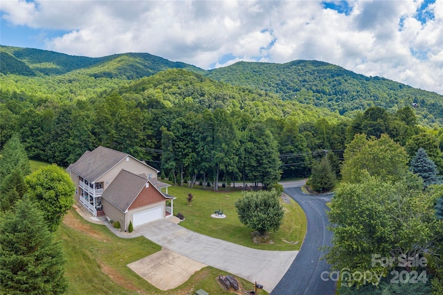 birds eye view of property with a mountain view