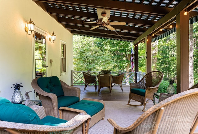 view of patio with an outdoor living space and ceiling fan