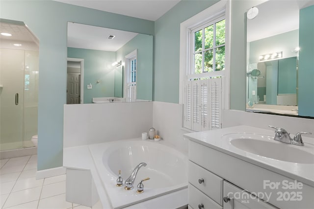 full bathroom with toilet, vanity, plus walk in shower, and tile patterned flooring