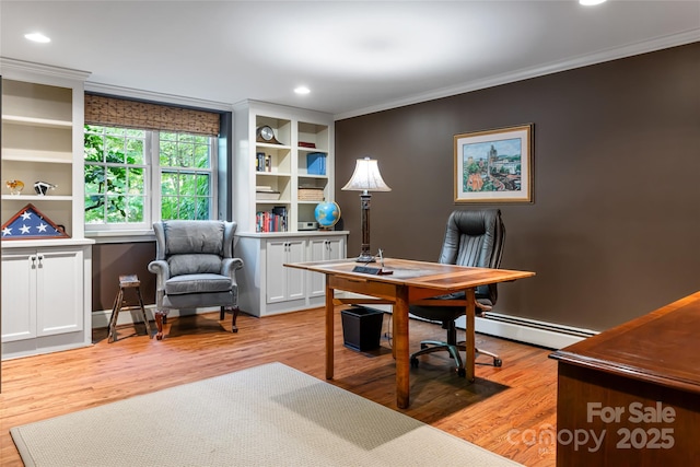 office area with ornamental molding, a baseboard heating unit, and light hardwood / wood-style floors