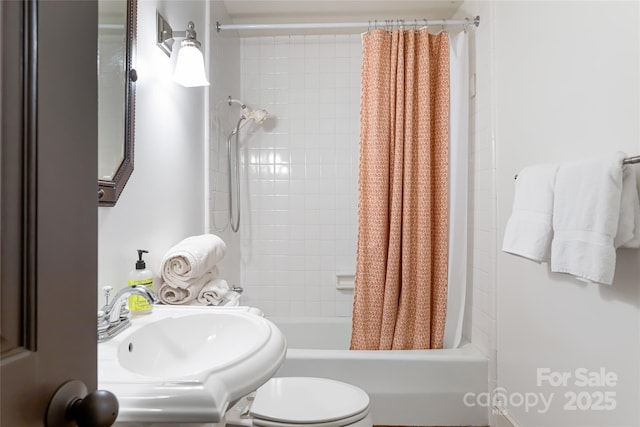 full bathroom featuring toilet, sink, and shower / tub combo